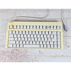 iOne Scorpius 83 Compact Keyboard PS/2 Beige Tested - Needs Cleaned Missing Foot